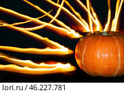 Orange pumpkin on background of fire lines, copy space. Стоковое фото, фотограф Зарифа Арсланова / Фотобанк Лори