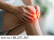 Knee pain, joint inflammation, arthritis and degenerative changes, woman suffering from leg ache and doing self-massage. Стоковое AI-изображение, AI-художник Станислав Тарко / Фотобанк Лори