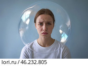 Sad woman with a transparent protective sphere around her head. Стоковое AI-изображение, AI-художник Дмитрий Киселёв / Фотобанк Лори