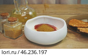The chef creates a delicious spicy dressing by mixing yellowish seasonings or peppers with ketchup, tomato paste, and mayonnaise. Стоковое видео, видеограф Strunov David / Фотобанк Лори