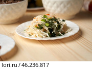 Stewed cabbage quiet conversation with God Stewed cabbage on a wooden background symbolizes quiet conversation with God, which takes place through prayer and reading Word during the days of fasting. Стоковое фото, фотограф Скрипачев Антон / Фотобанк Лори