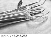 Tray with dental instruments and occlusal splint, closeup. Стоковое фото, фотограф Pixel_shot / Фотобанк Лори