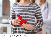 Little girl with model of stomach at gastroenterologist's office, closeup. Стоковое фото, фотограф Pixel_shot / Фотобанк Лори