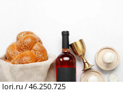 Traditional challah bread with wine and candles on white background. Shabbat Shalom. Стоковое фото, фотограф Pixel_shot / Фотобанк Лори