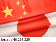 Flags of China and Japan as background. Стоковое фото, фотограф Pixel_shot / Фотобанк Лори