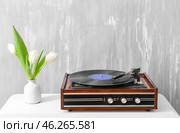 Record player with vinyl disc on table. Стоковое фото, фотограф Pixel_shot / Фотобанк Лори