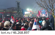 Sremska Mitrovica, Serbia 15.02.2025: Supporters of Aleksandar Vucic, Serbian statesman, politician, President of the Republic of Serbia. Supporters gathered at rally waving flags and chanting slogans (2017 год). Редакционное видео, видеограф Юлия Петровская / Фотобанк Лори