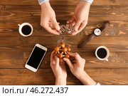 Young people with brain teasers at wooden table. Стоковое фото, фотограф Pixel_shot / Фотобанк Лори