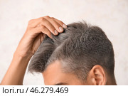 Man with graying hair on light background, closeup. Стоковое фото, фотограф Pixel_shot / Фотобанк Лори