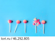 Broken lollipop among whole ones on color background. Concept of uniqueness. Стоковое фото, фотограф Pixel_shot / Фотобанк Лори