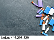 Alkaline batteries on black background. Стоковое фото, фотограф Pixel_shot / Фотобанк Лори