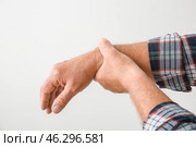 Senior man suffering from Parkinson syndrome on grey background. Стоковое фото, фотограф Pixel_shot / Фотобанк Лори