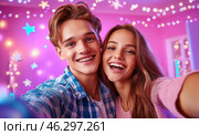 A happy young couple takes a selfie against the backdrop of bright garlands and sparkling snowflakes, conveying an atmosphere of joy, coziness and festive mood. Стоковое AI-изображение, AI-художник ArtVladZ / Фотобанк Лори