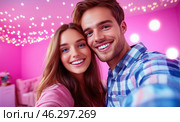 A happy young couple takes a selfie against the backdrop of bright garlands and sparkling snowflakes, conveying an atmosphere of joy, coziness and festive mood. Стоковое AI-изображение, AI-художник ArtVladZ / Фотобанк Лори