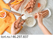 Woman preparing sweet bubble waffles at table, top view. Стоковое фото, фотограф Pixel_shot / Фотобанк Лори