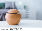 Aroma oil diffuser on table in room. Стоковое фото, фотограф Pixel_shot / Фотобанк Лори
