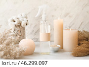 Natural air freshener and aroma candles on light background. Стоковое фото, фотограф Pixel_shot / Фотобанк Лори