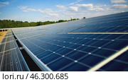 A solar panel stands under the bright sun, absorbing its energy to generate clean electricity. Its sleek, reflective surface glistens, symbolizing renewable power and sustainability. Стоковое AI-видео, аниматор Ирина Старикова / Фотобанк Лори