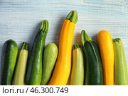 Fresh zucchinis on white wooden table. Стоковое фото, фотограф Pixel_shot / Фотобанк Лори
