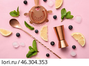 Ingredients for cocktail, double jigger, strainer and mixing spoon on color background. Стоковое фото, фотограф Pixel_shot / Фотобанк Лори