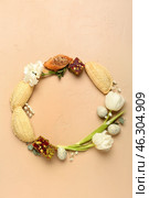 Frame made of flowers, eggs and treats on beige background. Novruz Bayram celebration. Стоковое фото, фотограф Pixel_shot / Фотобанк Лори