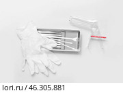 Medical gloves with gynecological speculum and pap smear test tools on light background. Стоковое фото, фотограф Pixel_shot / Фотобанк Лори