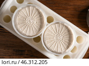 Forms with freshly made cheese on wooden table. Стоковое фото, фотограф Pixel_shot / Фотобанк Лори