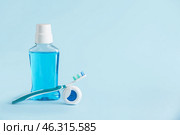 Tooth brush, mouth rinse and paste on color background. Стоковое фото, фотограф Pixel_shot / Фотобанк Лори