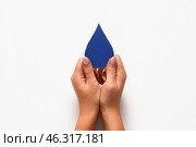 Female hands with paper drop on white background. World Polio Day. Стоковое фото, фотограф Pixel_shot / Фотобанк Лори