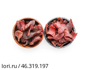 Bowls with spicy beef jerky on white background. Стоковое фото, фотограф Pixel_shot / Фотобанк Лори