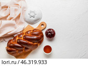 Traditional challah bread with Jewish cap on white background. Shabbat Shalom. Стоковое фото, фотограф Pixel_shot / Фотобанк Лори