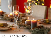 Beautiful table setting with Christmas decorations in living room. Стоковое фото, фотограф Pixel_shot / Фотобанк Лори