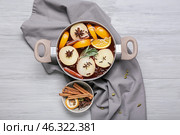 Saucepan with hot mulled wine on table. Стоковое фото, фотограф Pixel_shot / Фотобанк Лори