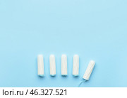 Tampons on color background, top view. Стоковое фото, фотограф Pixel_shot / Фотобанк Лори
