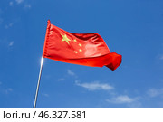 Flag of China against blue sky. Стоковое фото, фотограф Pixel_shot / Фотобанк Лори
