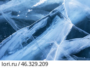 Unique texture of ice. Cold blue ice background with cracks, fracture lines in thickness of ice surface of frozen Baikal Lake in winter day. Top view, close-up, flat lay, mockup, copy space, blank. Стоковое фото, фотограф Виктория Катьянова / Фотобанк Лори