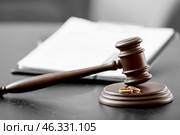 Judge's gavel, rings and divorce decree on dark background. Стоковое фото, фотограф Pixel_shot / Фотобанк Лори