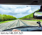 Driving through a winter landscape with icy doors and poor visibility challenges. Стоковое фото, фотограф Кривошеина Елена Леонидовна / Фотобанк Лори