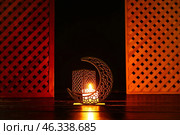 Arabic candle holder with glowing candle on dark background. Стоковое фото, фотограф Pixel_shot / Фотобанк Лори