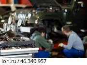Workshop for car repair with table with different tools in garage. Стоковое фото, фотограф Яков Филимонов / Фотобанк Лори