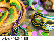 Festive cake for Mardi Gras (Fat Tuesday) holiday with decor on grey table. Стоковое фото, фотограф Pixel_shot / Фотобанк Лори