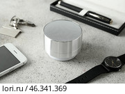 Smart home assistant device on grey table. Стоковое фото, фотограф Pixel_shot / Фотобанк Лори