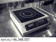 Induction cooker in restaurant kitchen. Стоковое фото, фотограф Pixel_shot / Фотобанк Лори