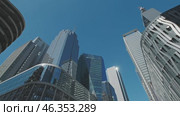 Skyscrapers soar in urban cityscape. Стоковое видео, видеограф Михаил Коханчиков / Фотобанк Лори