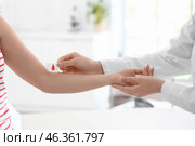 Female doctor applying gauze on donor's arm in clinic, closeup. Стоковое фото, фотограф Pixel_shot / Фотобанк Лори