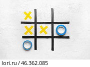 Tic-tac-toe game made of adhesive tapes on white background. Стоковое фото, фотограф Pixel_shot / Фотобанк Лори
