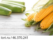 Tasty corncobs on wooden table. Стоковое фото, фотограф Pixel_shot / Фотобанк Лори