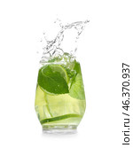 Glass of fresh mojito with splashes on white background. Стоковое фото, фотограф Pixel_shot / Фотобанк Лори