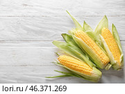 Tasty corncobs on wooden table. Стоковое фото, фотограф Pixel_shot / Фотобанк Лори