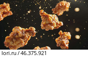 Grilled chicken legs, drumsticks falling in the air, isolated on black background, food concept. Crispy fried chicken nuggets levitation. Roast chicken strips, pieces flying in the air. Dynamic scene. Стоковое AI-видео, аниматор Марина Демидюк / Фотобанк Лори